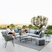 Sleek gray outdoor sofa set with plush cushions and a stylish patterned area rug, perfect for modern patio decor.