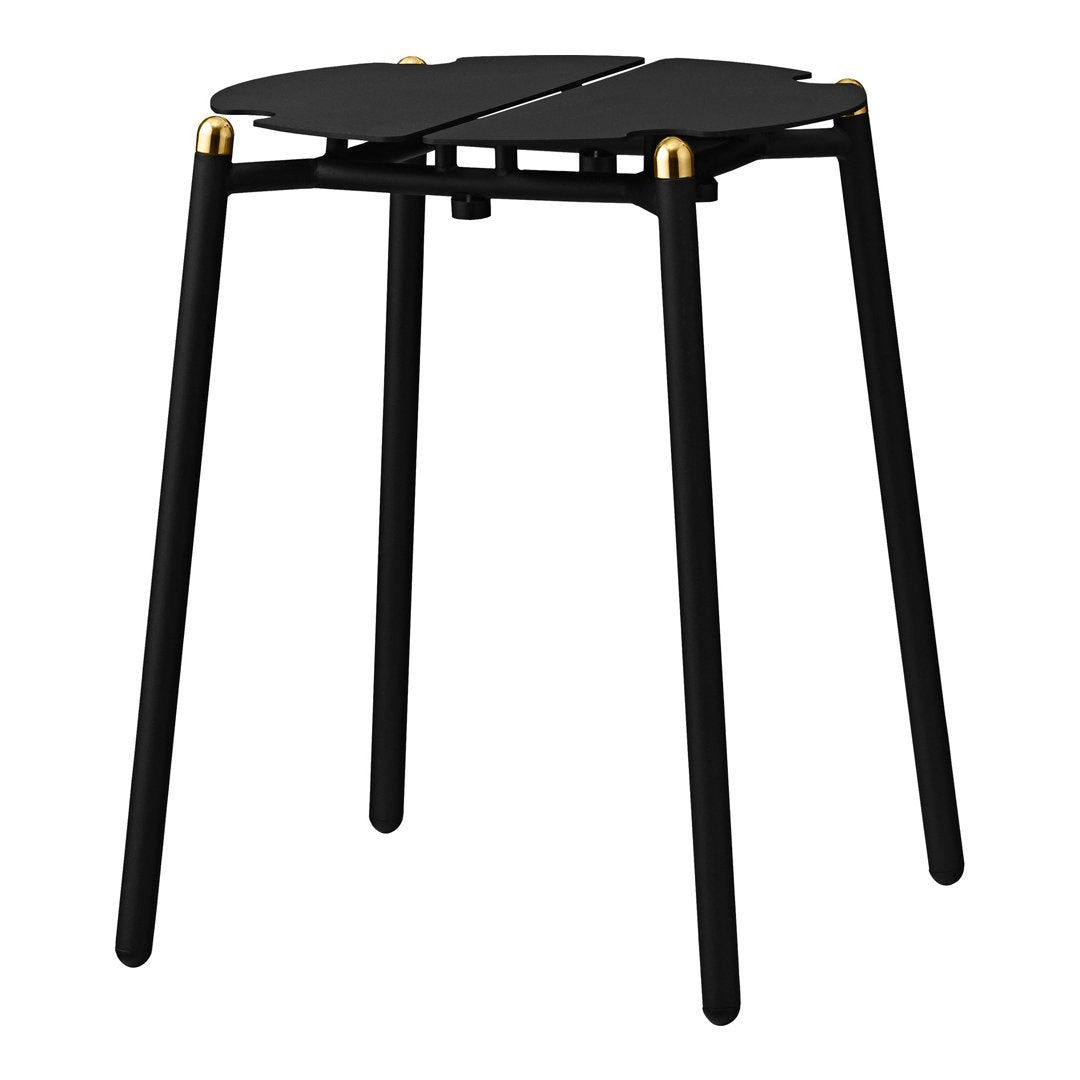 Black minimalist stool with elegant gold accents and a unique overlapping circular design.