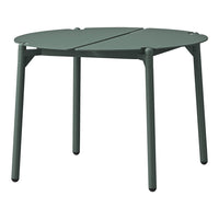 Green folding table with a minimalist design and smooth surfaces, perfect for outdoor or indoor use.