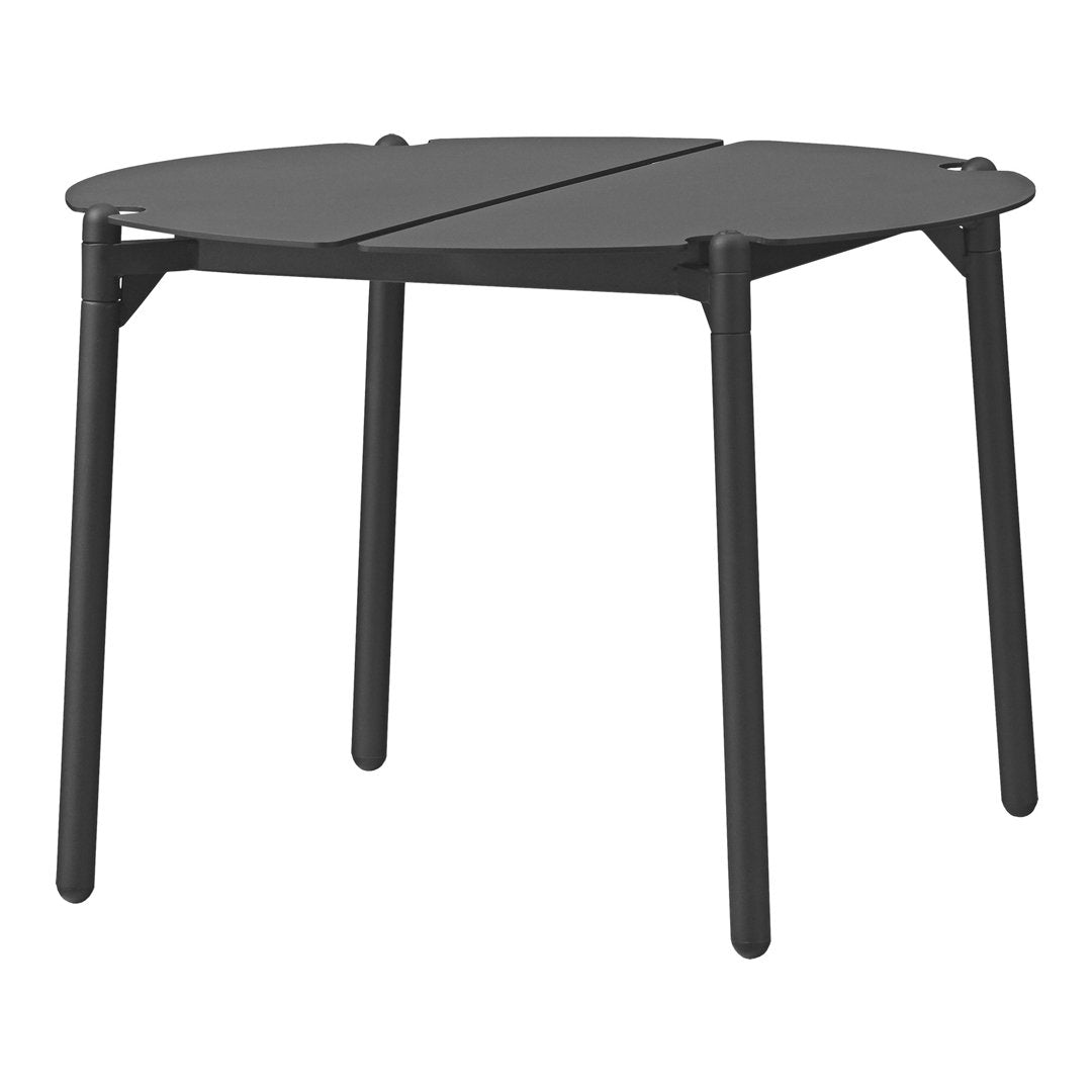 Black folding table with a sleek, modern design and smooth, circular shape. Perfect for versatile spaces.