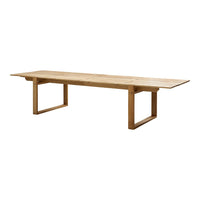 Natural wood finish dining table with smooth, light oak surface and minimalist rectangular design.