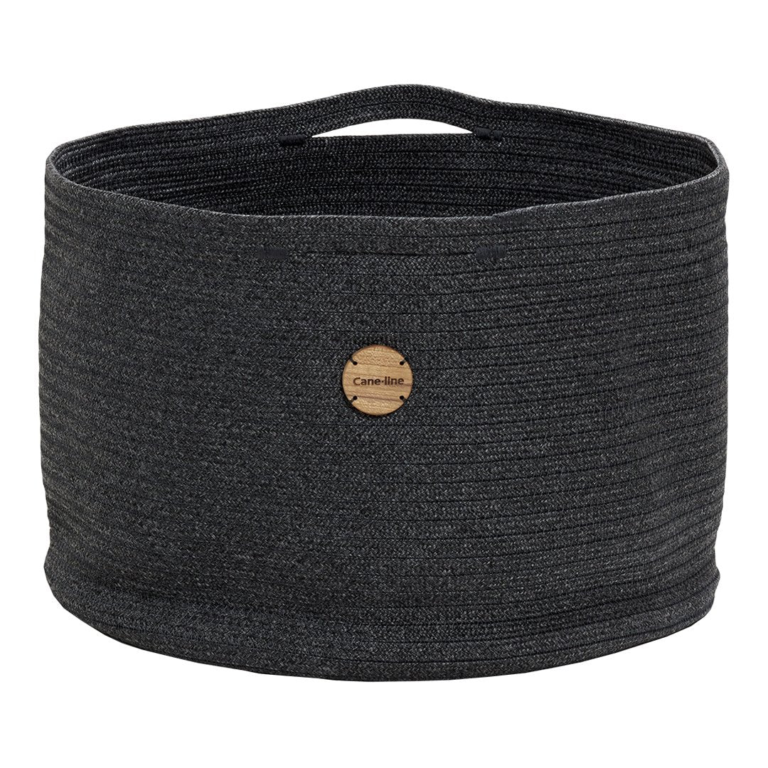 Gray woven storage basket with a textured pattern and wooden tag detail. Ideal for home organization.