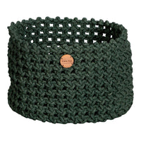 Handwoven green basket featuring a textured, open-knit pattern and a decorative wooden tag.