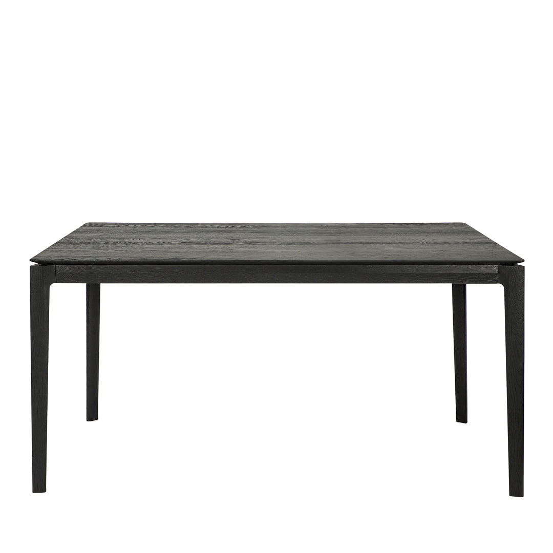 Black wooden dining table with a textured surface and sleek, modern design. Perfect for contemporary interiors.