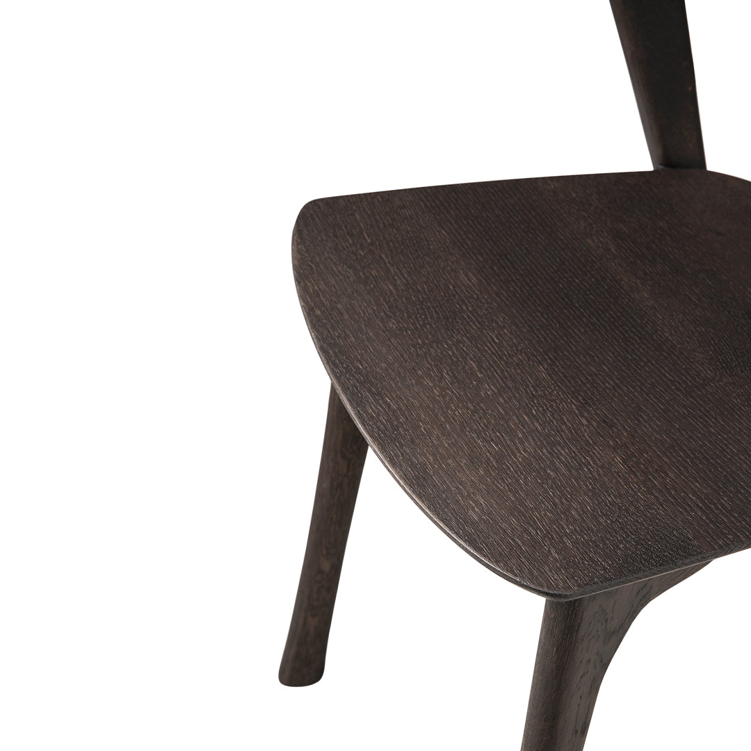 Dark wood chair with a smooth, minimalist design and subtle grain patterns for a modern look.