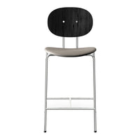 Black wood and neutral beige fabric bar stool with a sleek chrome frame. Modern design with minimalist style.