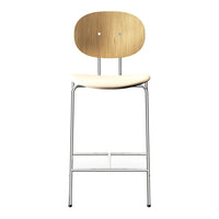 Natural wood finish with a smooth light beige seat and sleek chrome legs. Modern minimalist design.