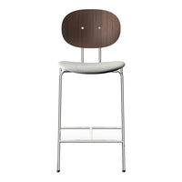 Modern bar stool with a dark wood back, light gray seat, and sleek chrome legs, showcasing minimalist design.