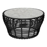 Black woven base coffee table with a round gray stone tabletop, featuring natural textures and a modern design.
