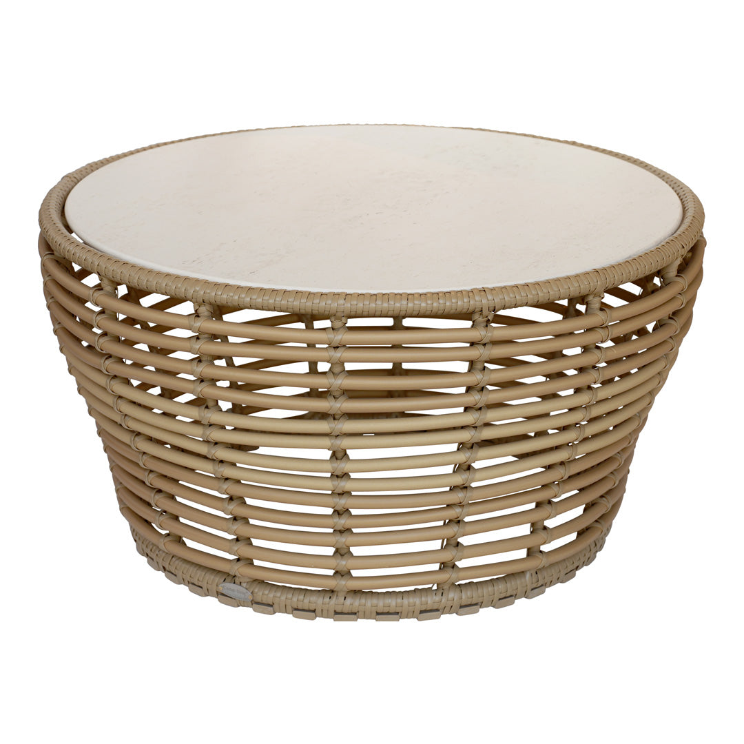 Round wicker coffee table in natural brown tones with a smooth white tabletop, showcasing a stylish woven pattern.
