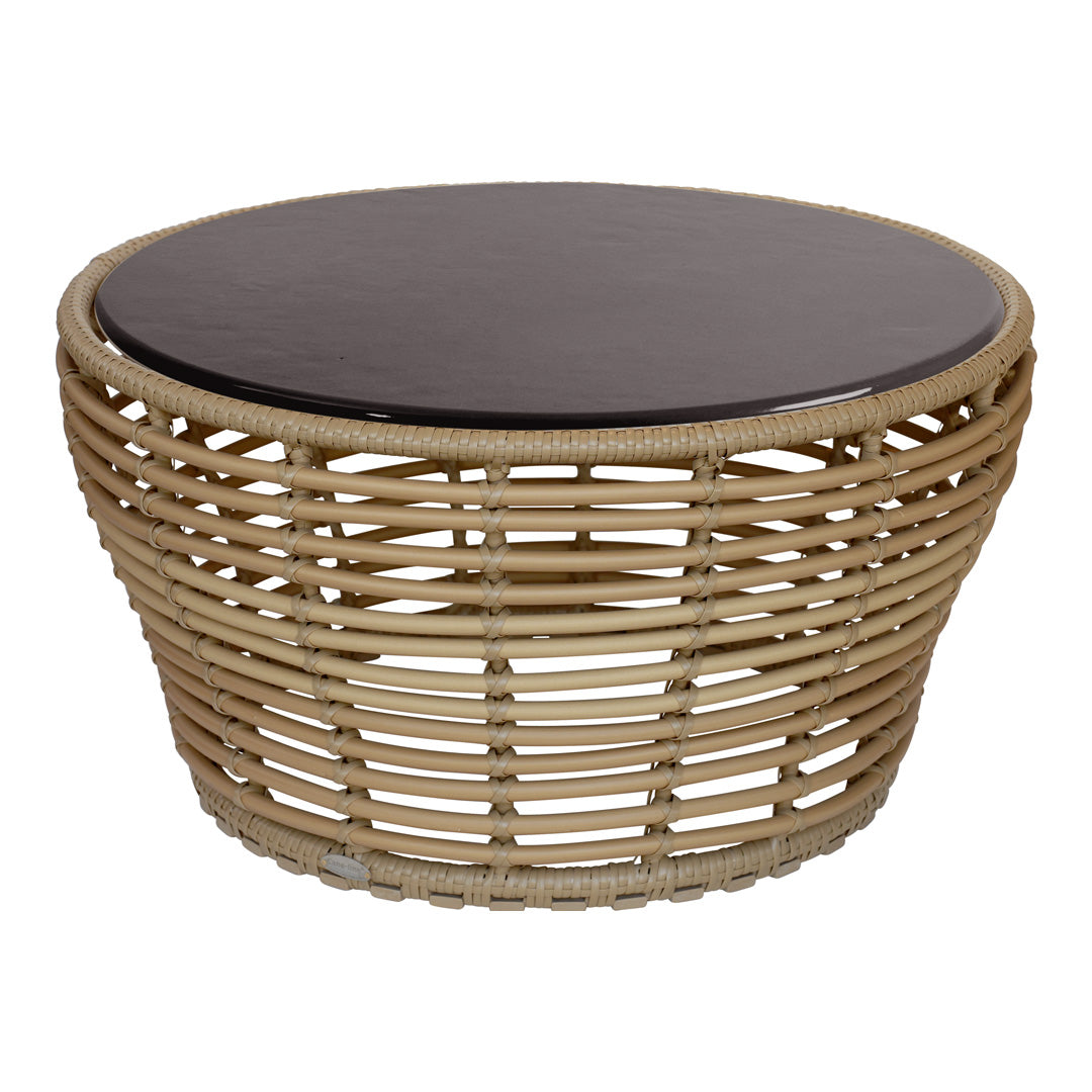 Round wicker coffee table with a natural tan base and sleek dark brown top. Perfect blend of textures and colors.