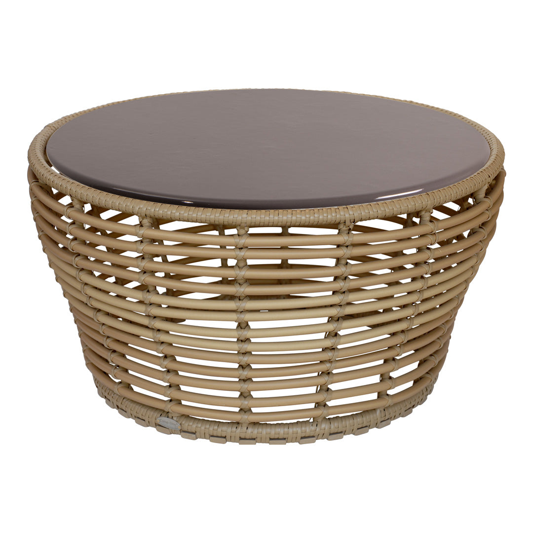 Round wicker coffee table with a natural beige base and a sleek, dark brown glass top.