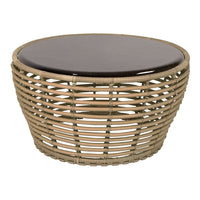 Round woven coffee table with natural beige rattan base and a glossy dark brown top. Stylish and modern design.