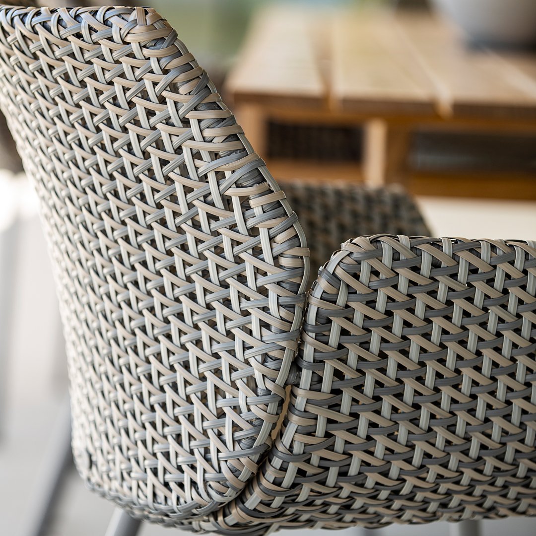 Woven gray and beige chair pattern, featuring a rustic, textured design perfect for modern decor.