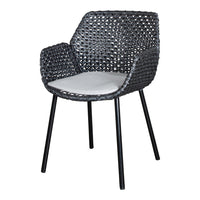 Black woven chair with contrasting white cushion, featuring a modern, stylish pattern. Ideal for outdoor or indoor use.