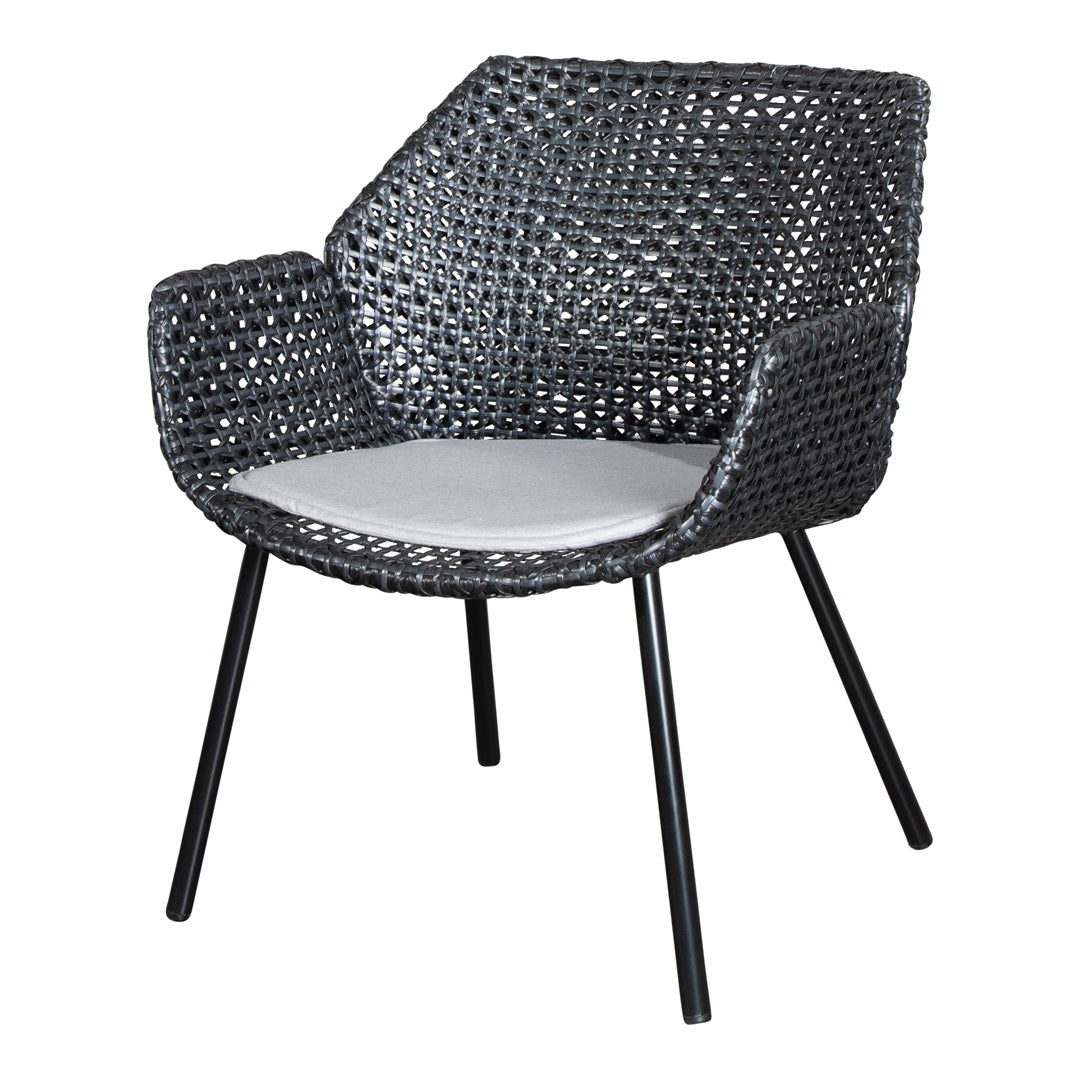 Black woven chair with a modern pattern and a light grey cushion on a sleek black metal frame.