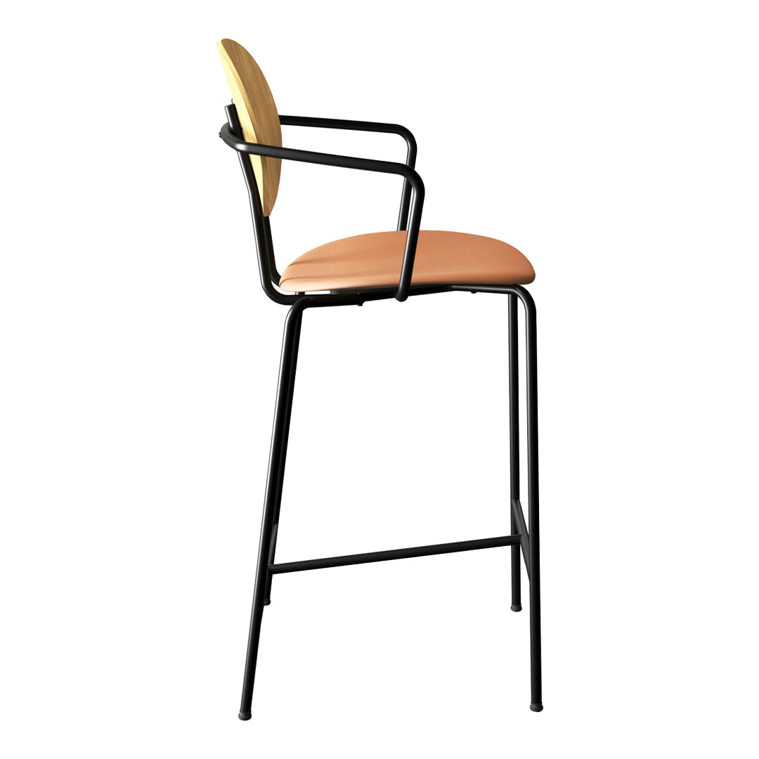 Modern black metal barstool with a peach seat and natural wood backrest, combining sleek design with contemporary colors.