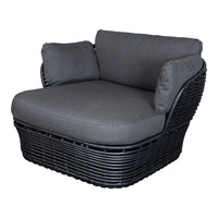 Black wicker chair with dark gray cushions, featuring a modern design and comfortable seating. Ideal for indoor or outdoor use.