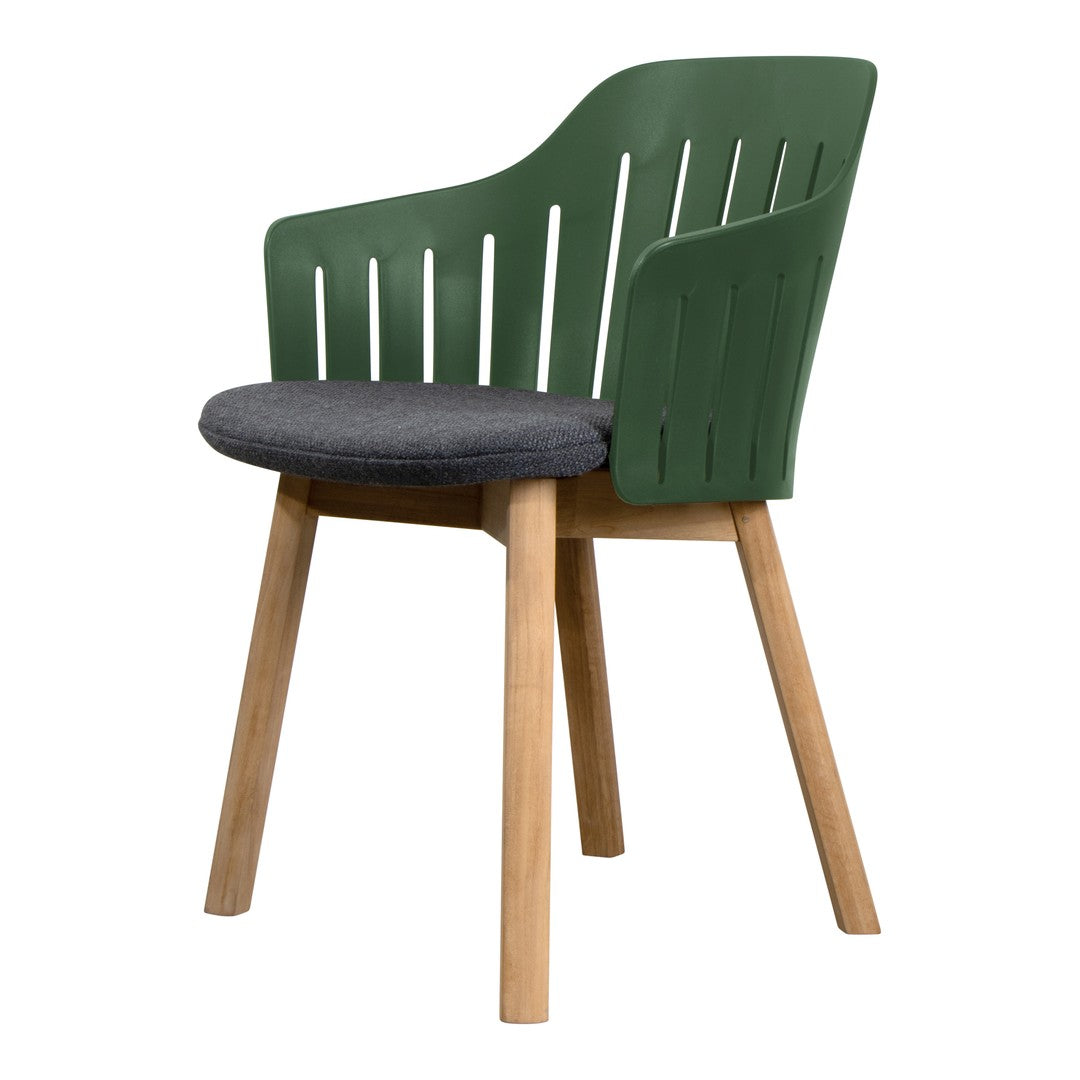 Stylish green chair with slatted back, gray cushioned seat, and natural wood legs. Perfect for modern spaces.