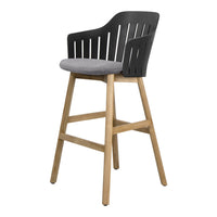 Black slatted back bar stool with a grey upholstered seat and natural wood legs. Modern design with a sleek finish.