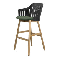 Black slatted backrest bar stool with a green patterned fabric seat and natural wood legs. Ideal for modern decor.