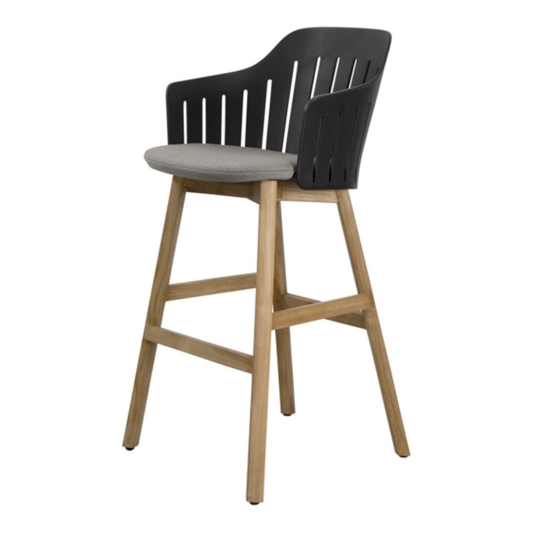 Stylish black slatted back chair with a gray cushion and natural wood legs, perfect for modern decor.