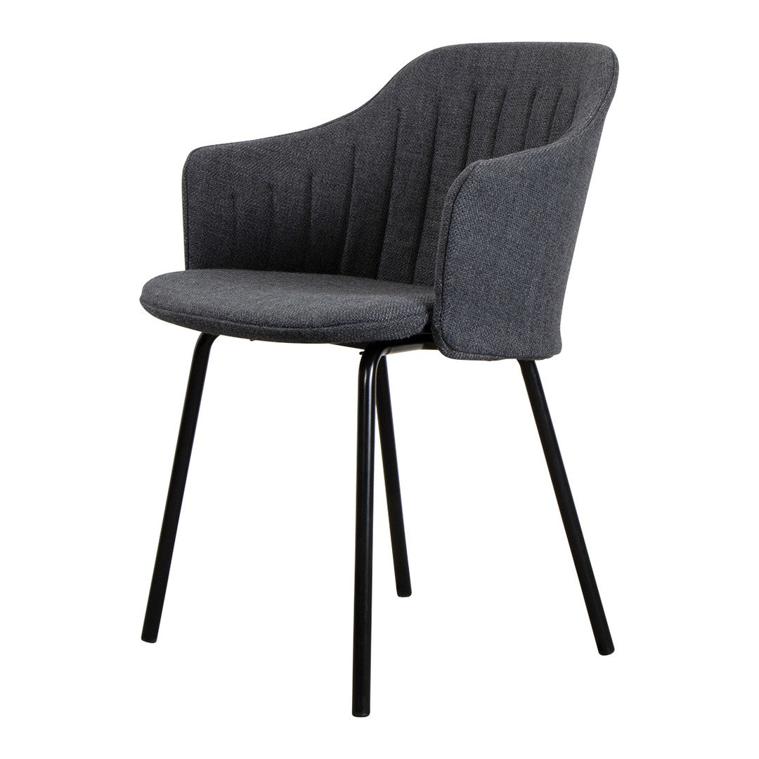 Gray upholstered chair with vertical ribbed pattern and sleek black metal legs. Perfect for modern decor.