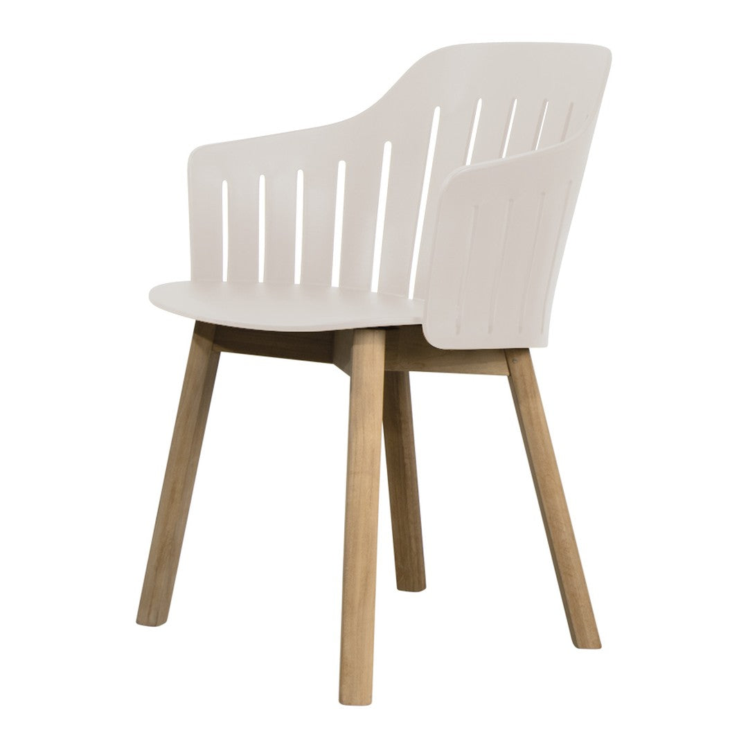 Modern white chair with slatted back and natural wood legs, featuring a sleek and minimalist design.