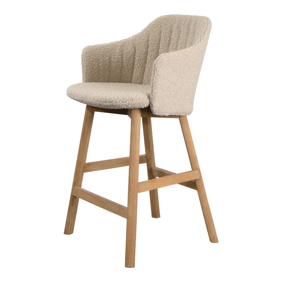 Beige upholstered bar stool with a textured pattern and wooden legs, perfect for modern decor.