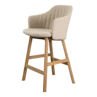 Beige upholstered bar stool with a textured pattern and wooden legs, perfect for modern decor.