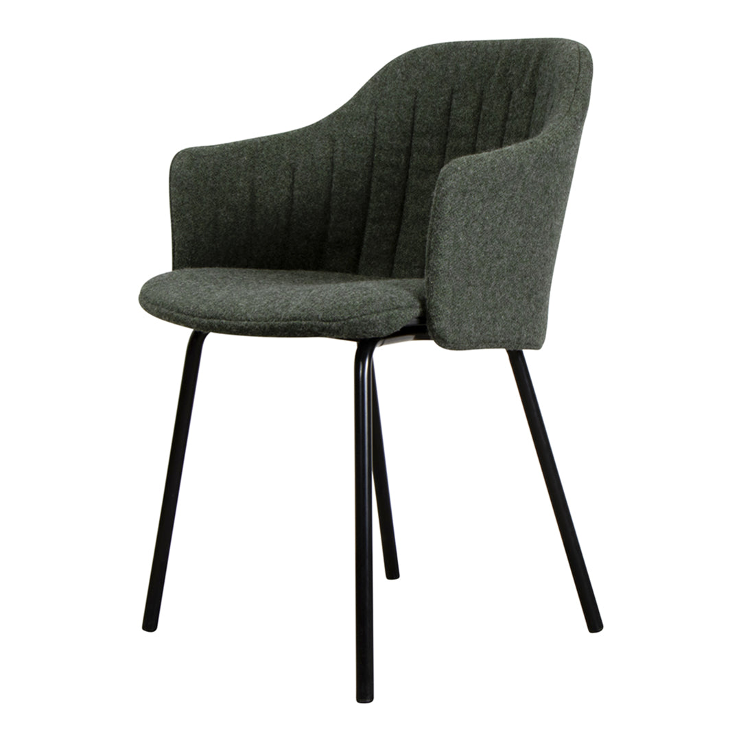 Green upholstered chair with ribbed pattern and black metal legs, offering a modern and stylish accent for any space.