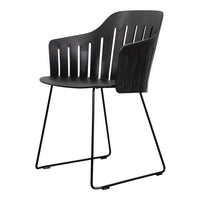 Modern black chair with a slatted design and sleek black metal legs, perfect for contemporary decor.