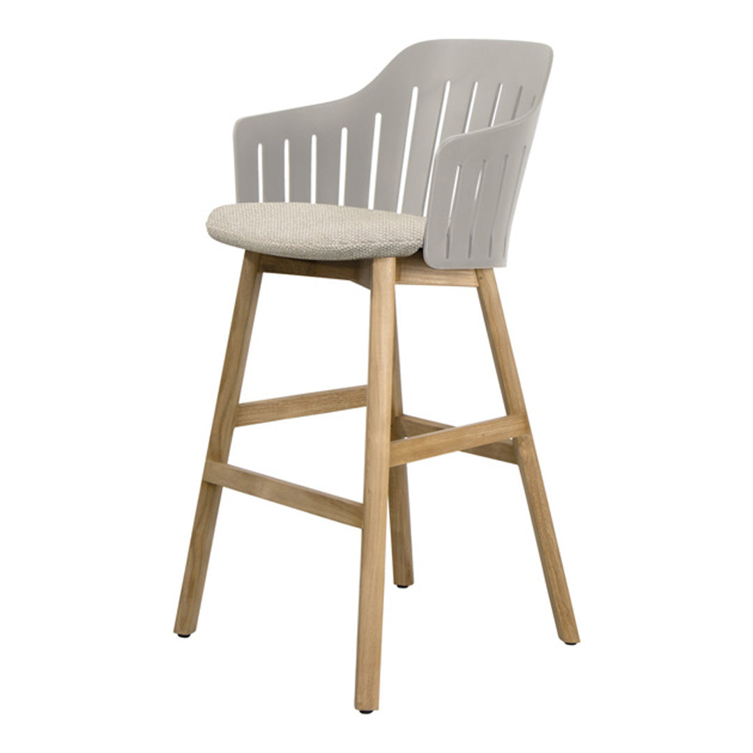 Light gray bar stool with slatted backrest and beige upholstered seat on natural wood legs. Modern design, versatile style.