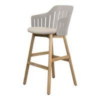 Light gray bar stool with slatted backrest and beige upholstered seat on natural wood legs. Modern design, versatile style.