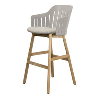 Light gray plastic chair with a patterned beige cushion and natural wood legs, perfect for modern decor.