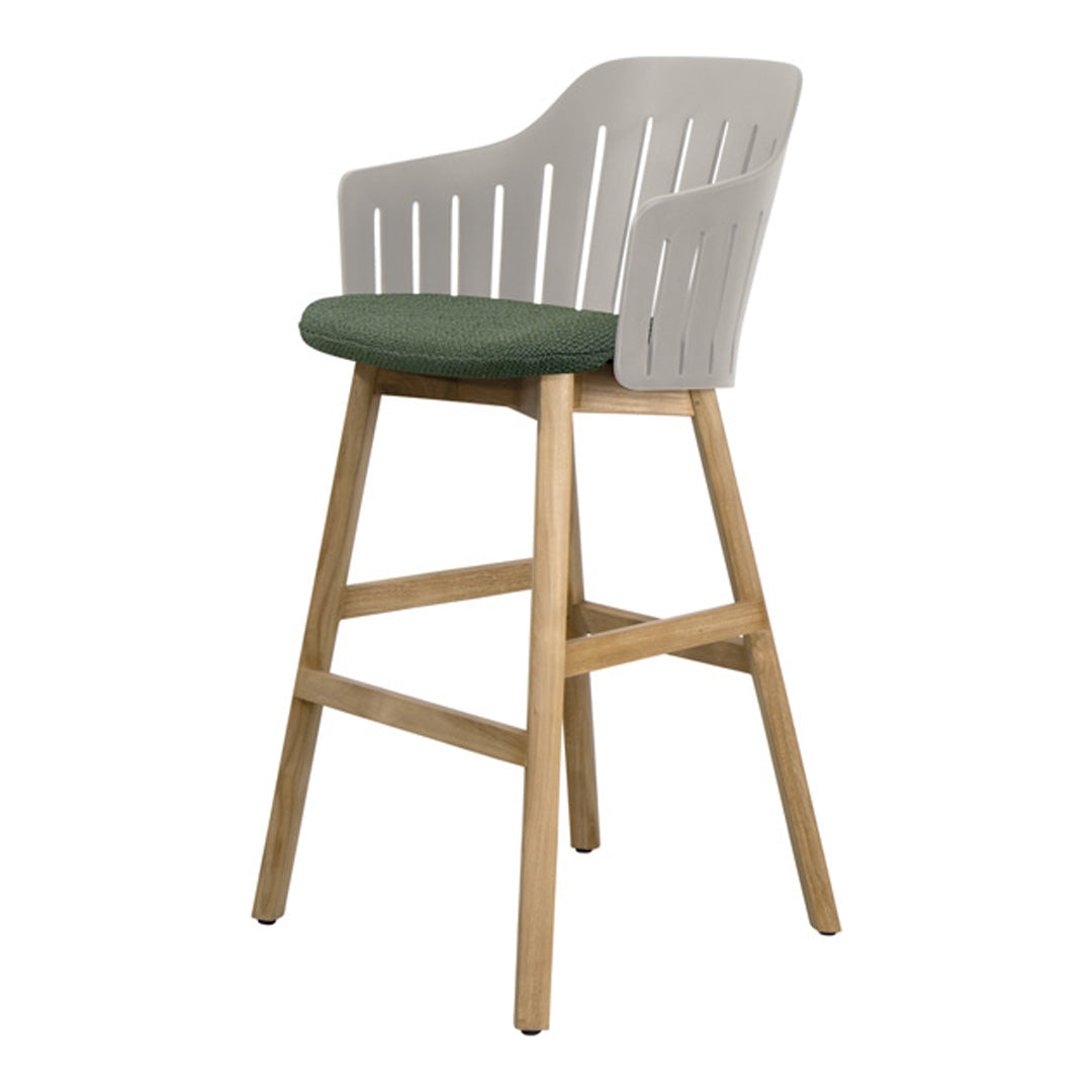Modern bar stool with a white plastic back and green cushion, featuring a natural wood frame. Contemporary design.