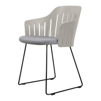Light gray chair with slatted back and a soft gray cushion, featuring a sleek black metal frame.