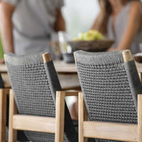 Gray woven chair backs with a light wood frame, showcasing modern patterns for a stylish dining area.
