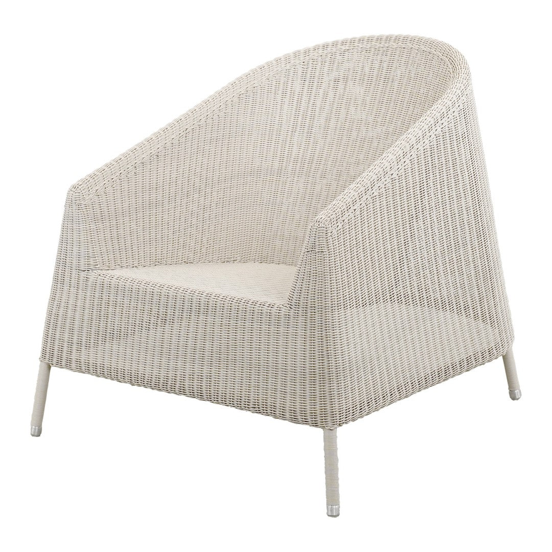 White woven armchair with a minimalist design and soft lines, showcasing a subtle pattern and light, airy texture.