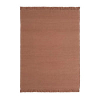Rust-colored woven area rug with a solid pattern and fringe detailing, perfect for adding warmth to any space.