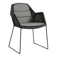 Stylish black woven outdoor chair with a sleek gray cushion, perfect for modern patio decor.