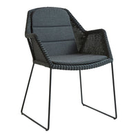 Gray woven chair with black metal legs and a sleek, modern design. Perfect for contemporary outdoor spaces.