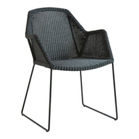 Black and gray woven patterned chair with sleek metal legs, ideal for modern outdoor or indoor decor.