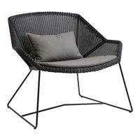 Gray woven chair with sleek black metal frame and a soft, light gray cushion. Modern, minimalist design.