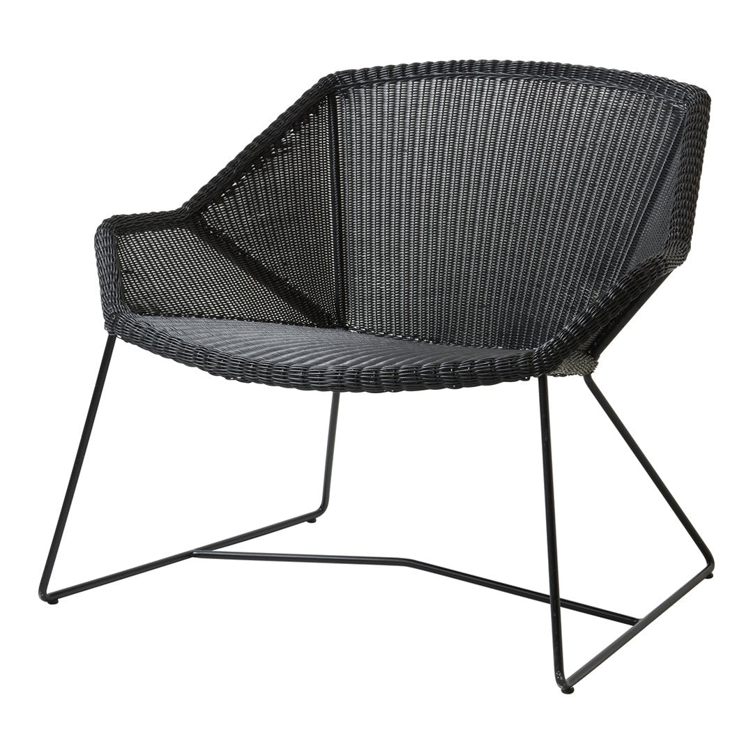 Black woven chair with a modern geometric pattern and sleek metal frame. Ideal for contemporary decor.