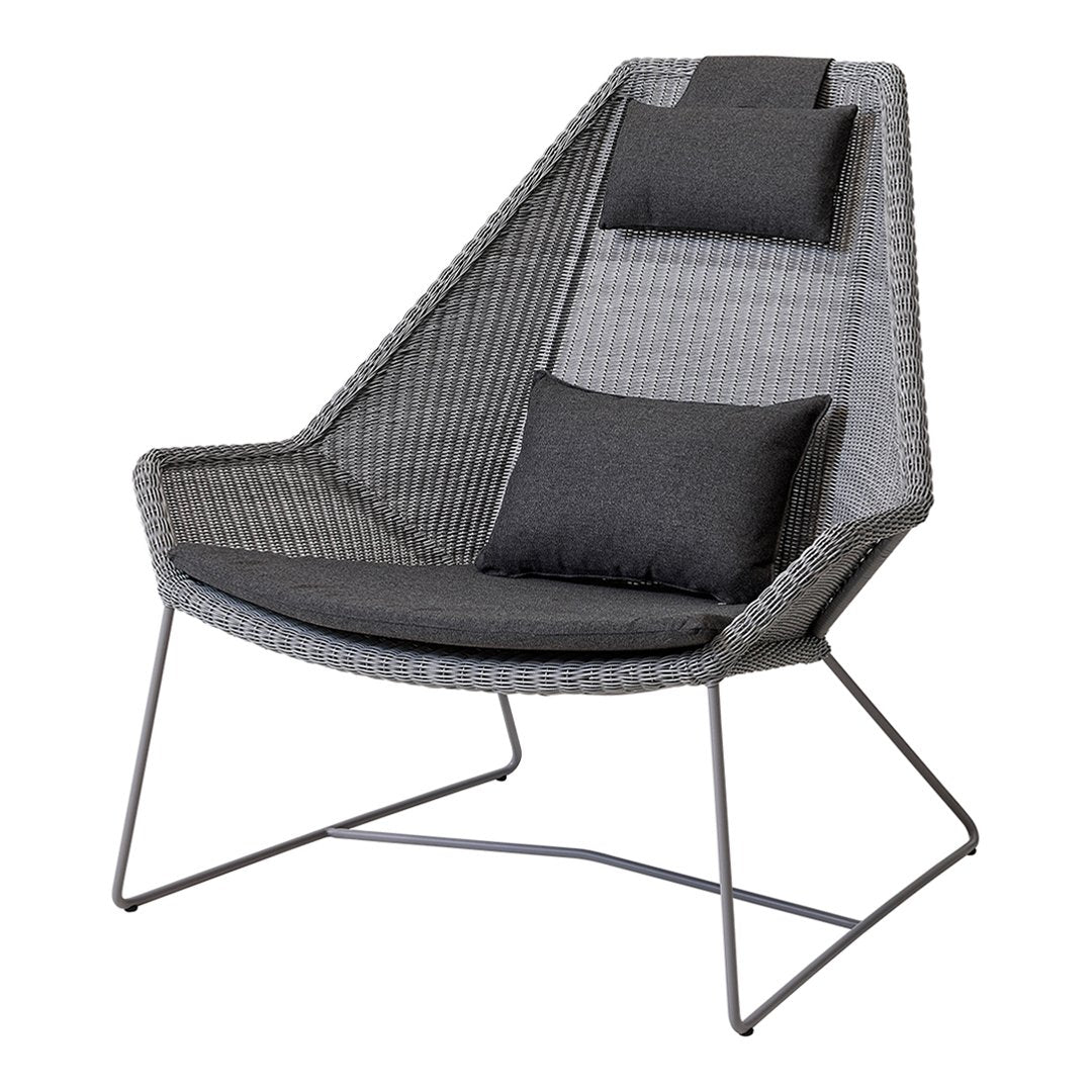 Gray lounge chair with unique geometric pattern, featuring two dark cushions for added comfort. Perfect for modern decor.