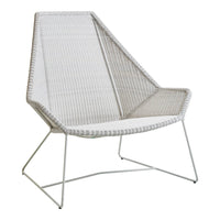 Stylish white woven chair with sleek lines and geometric patterns, perfect for modern decor.