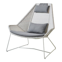 Textured white chair with gray cushions and a modern geometric pattern. Ideal for stylish indoor or outdoor settings.
