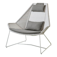 Stylish white and gray chair with vertical textured patterns and plush cushions, perfect for modern decor.