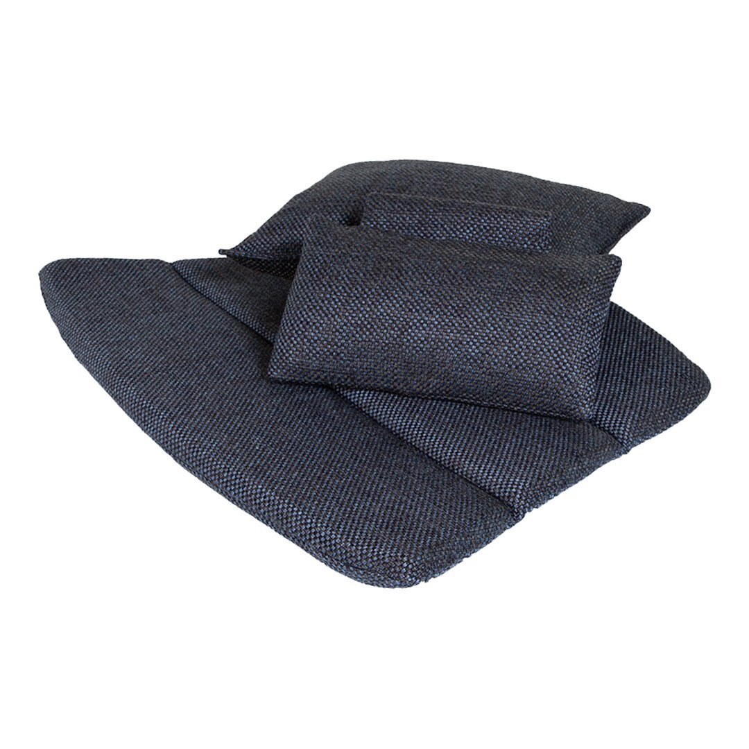 Dark blue textured cushions in various sizes, featuring a subtle woven pattern for a cozy appeal.